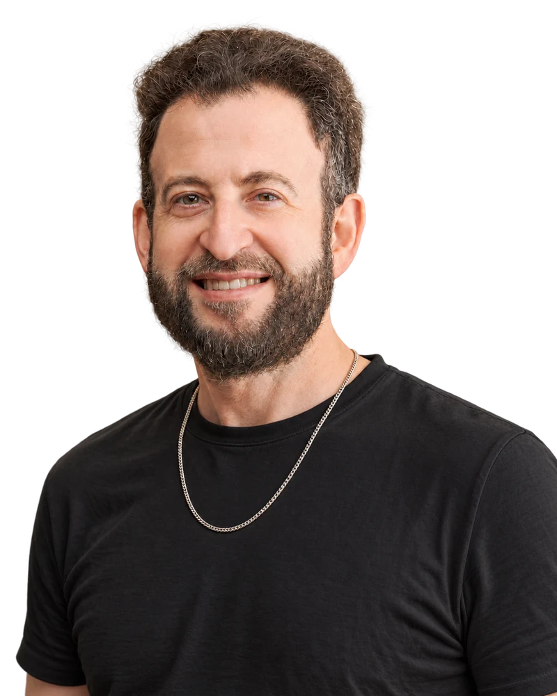 Yaron Helfer smiling in a black T-shirt